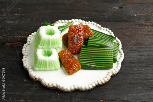 Three Various Jajan Pasar, Indonesian Traditional Snack for Tea Time, Kue Putu Ayu, Wajik, and Kuih Lapis Beras. photo