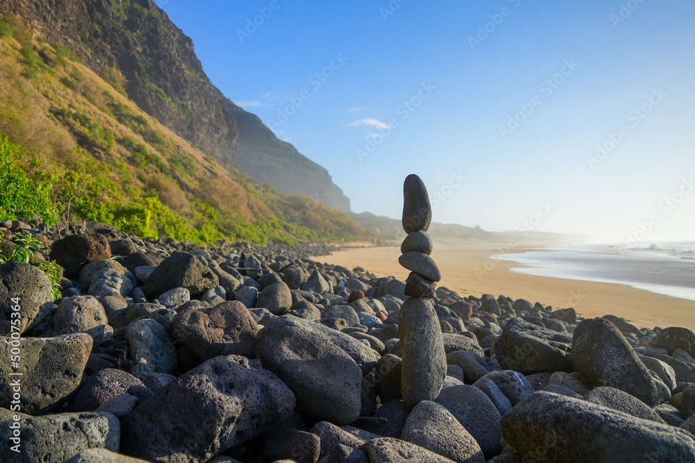Stones stacked on the beach of the Polihale State Park at the western ...