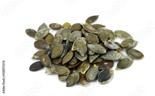 Bunch of pumpkin seed kernels isolated on white background..
