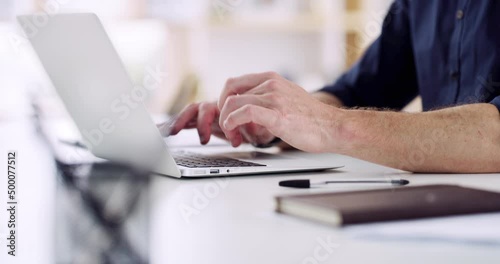 Modern day business would not exist without technology. 4k video footage of an unrecognizable businessman sitting alone in his office and using his laptop.