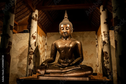 Photography Old Buddha statue in a Thai temple Ratchaburi, Thailand