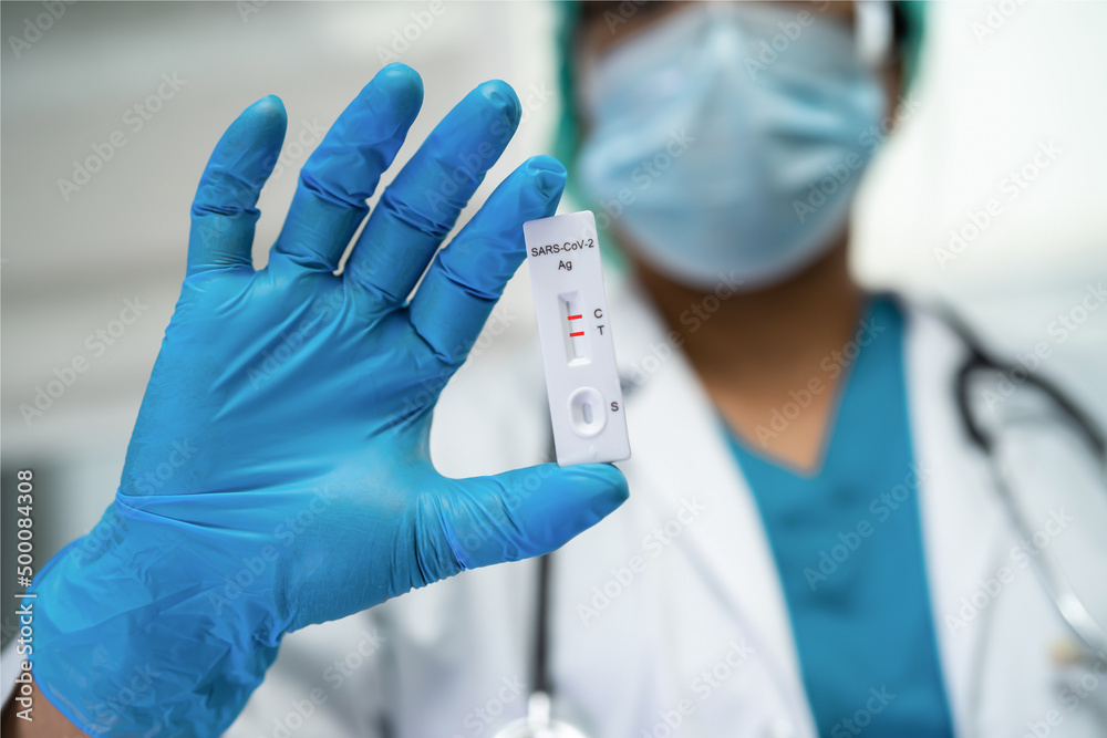 Asian doctor in PPE suit show positive test result with Saliva A