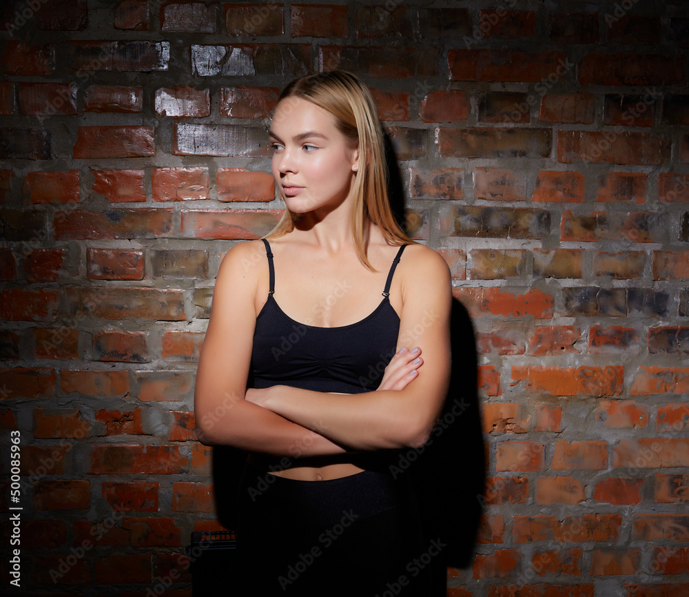 Sports girl blonde, in a black top, portrait Sports girl blonde, in a black top, portrait