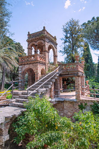 Vila Comunale park in Taormina, Sicily island, Italy. Old ruins in the park. 