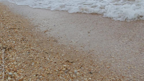 Strong waves with foam on the shore of the Sea of Azov, Ukraine photo