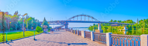 Panorama of Sicheslav embankment with pedestrian bridgre in Dnipro, Ukraine photo