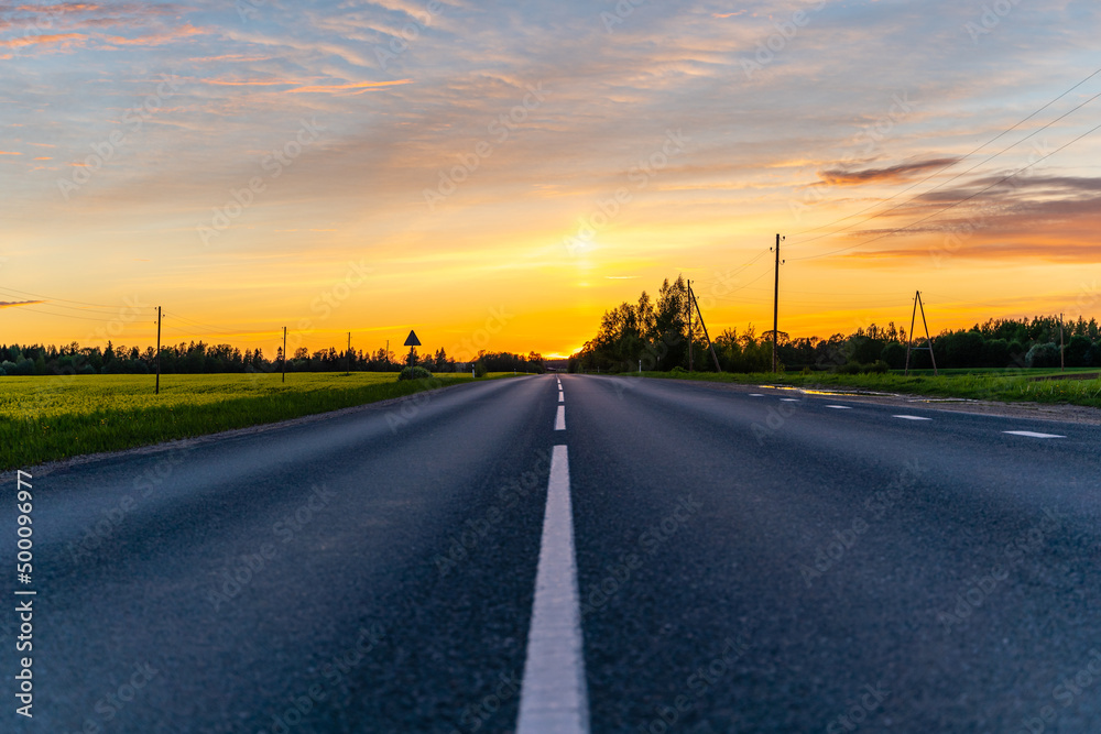 Empty Countryside Highway Road on Warm Summer Evening in Sunset Colors