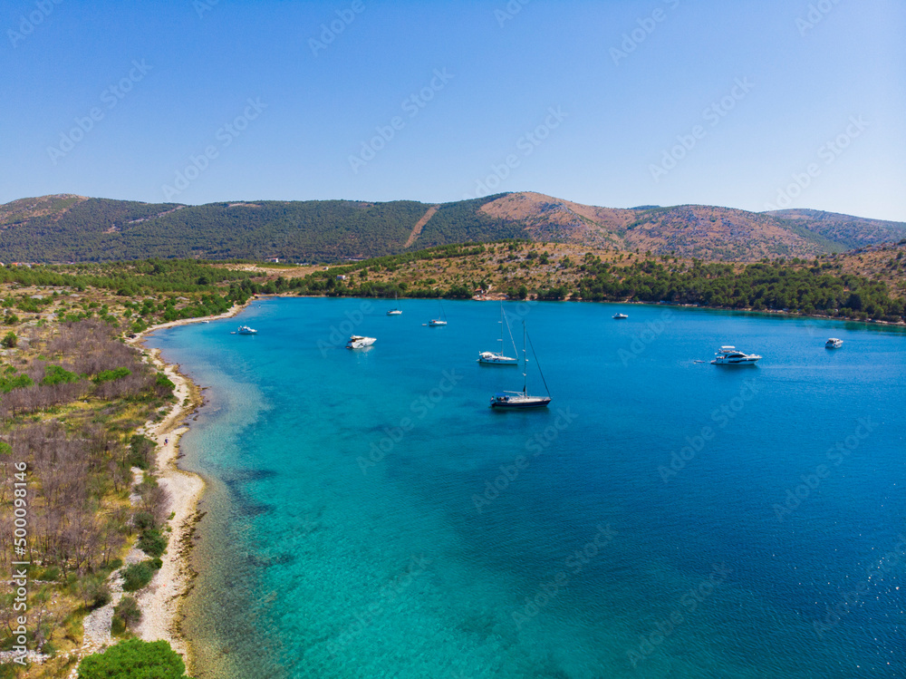 Croatia. Summer. Sunny day. Coast of the Adriatic Sea. Yachts in the lagoon. Holiday season. Popular tourist spot. Drone. Aerial view