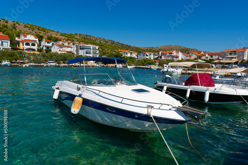 Croatia. Summer. Sunny day. Coast of the Adriatic Sea. Yacht parking near a small town by the sea. Holiday season. Popular tourist spot