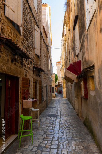 Croatia. Summer evening. Empty narrow street of old european mediterranean town. Tourist zone. Historical part of the city