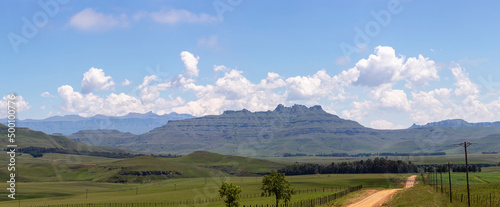 Cumulus clouds build up above the mountain