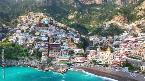 flying above idyllic colourful coastal town of Positano on the Amalfi coast Italy, holidays on Italian coast, famous Mediterranean resort with turquoise sea