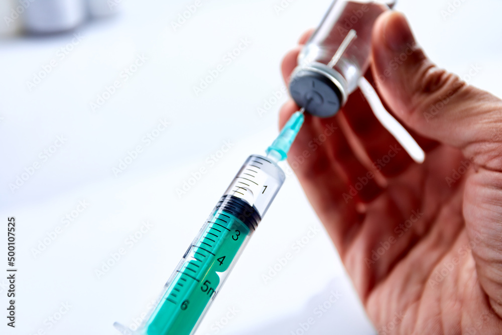  Vaccine in vial with syringe