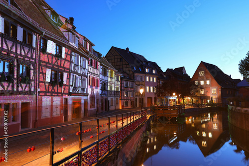 Colourful traditional half-timbered houses on river bank in Colmar, Alsace rigion, France