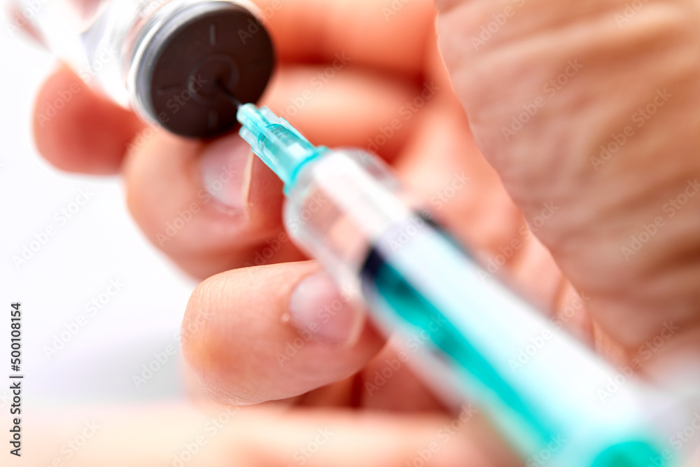 Vaccine in vial with syringe Vaccine in vial with syringe