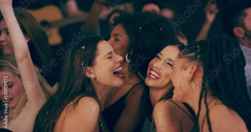 The party is thriving when everyones vibing. 4k video footage of young women dancing together at a party. photo
