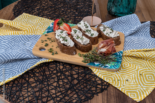 Bread with cheese served on a tray lying on napkins photo