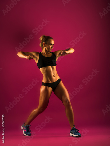 Fitness young woman in sports wear doing workout fitness aerobic exercise © serhii