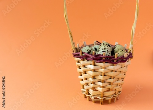 quail eggs in a basket, with selective focus