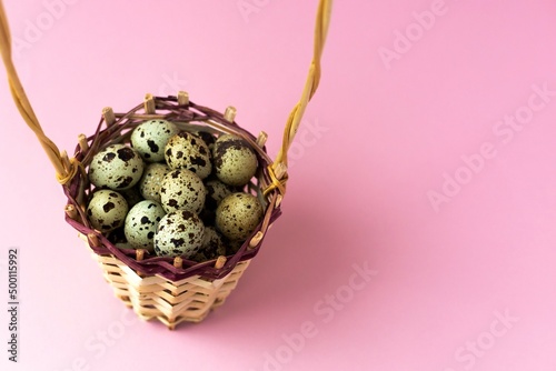 quail eggs in a basket, with selective focus