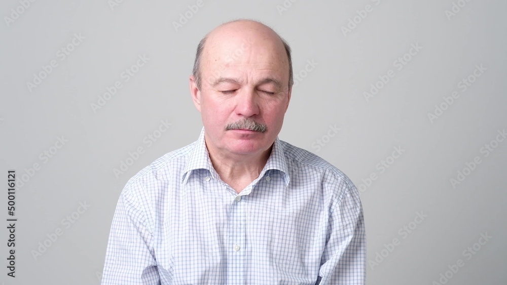 Senior bald european man feeling tired and sleepy Senior bald european man feeling tired and sleepy