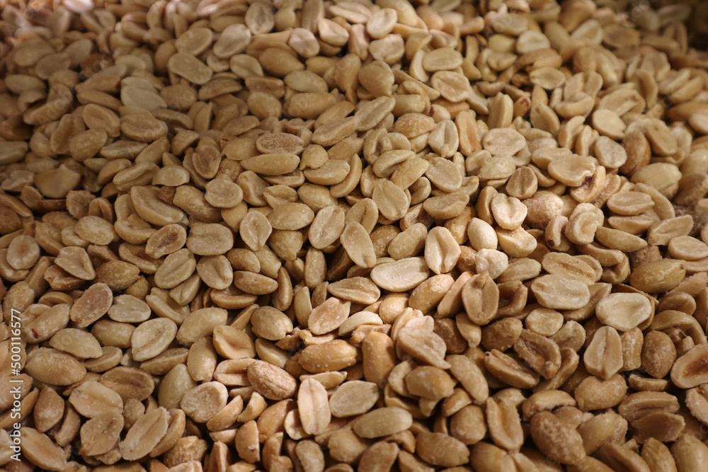 a scattering of salted peanuts. peeled peanuts a scattering of salted peanuts. peeled peanuts