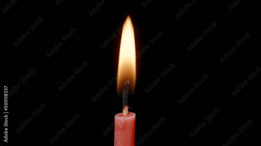 I blow out a red candle on a black background. Dolly slider extreme close-up. Laowa Probe I blow out a red candle on a black background. Dolly slider extreme close-up. Laowa Probe