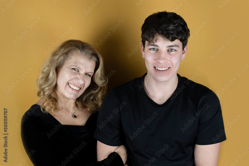 A woman and her teenage son communicate and joke, even a little fooling around, mom is happy and proud that she already has such an adult son. Mom and son have fun together A woman and her teenage son communicate and joke, even a little fooling around, mom is happy and proud that she already has such an adult son. Mom and son have fun together
