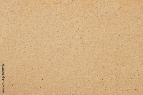 Texture of old craft paper, brown cardboard background