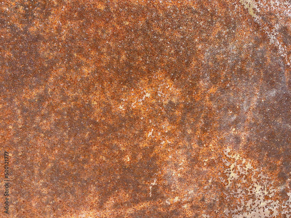 Photo of the texture of a rusty metal wall. Clean rusty background for text or lettering. Rusted metal.Corrosion on the wall. Photo of the texture of a rusty metal wall. Clean rusty background for text or lettering. Rusted metal.Corrosion on the wall.