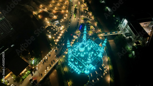 Aerial view of At-Thohir Mosque panorama at nihgt view Largest Mosque in Depok Place to visit in Indonesia. Depok, Indonesia, April 21, 2022 photo