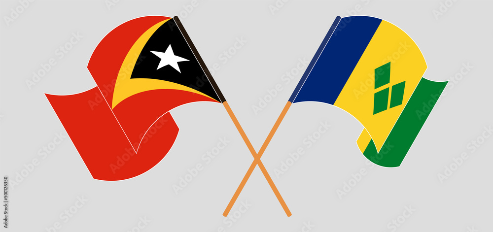 Crossed and waving flags of East Timor and Saint Vincent and the Grenadines