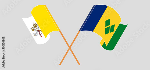Crossed and waving flags of Vatican and Saint Vincent and the Grenadines