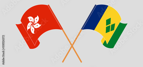 Crossed and waving flags of Hong Kong and Saint Vincent and the Grenadines