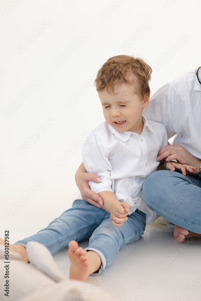 Vertical portrait of sad, crying little kid, boy with close eyes. Bad and negative emotions, stress and violence of kids Vertical portrait of sad, crying little kid, boy with close eyes. Bad and negative emotions, stress and violence of kids