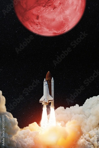 Spaceship lift off. Space shuttle with blast and smoke takes off to the red planet mars. Mars concept. Spacecraft lift off to explore other planets. Elements of this image furnished by NASA.