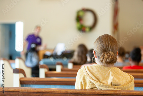 Girl sitting listening to instructor