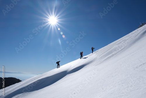 Hiking concepts of the triple mountaineer team on difficult and steep mountains