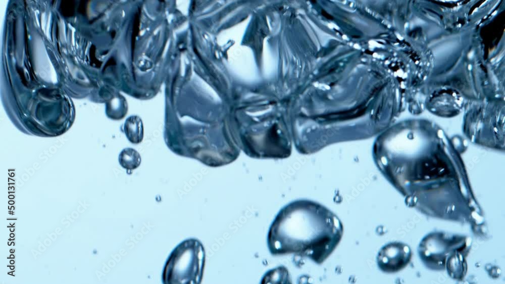 Authentic natural gas bubble wand horizontal loop background. Macro closeup full-frame studio shot of isolated transparent bubbles in clear liquid. Relaxing health and cosmetic concept with copy space Authentic natural gas bubble wand horizontal loop background. Macro closeup full-frame studio shot of isolated transparent bubbles in clear liquid. Relaxing health and cosmetic concept with copy space