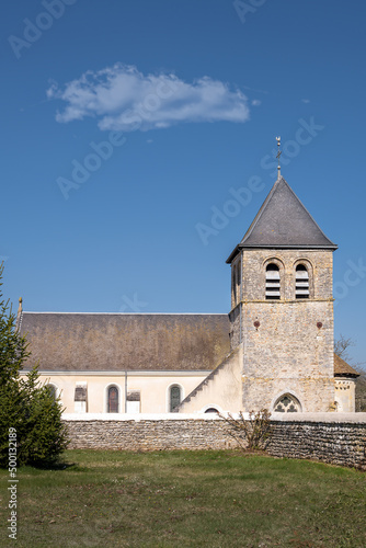 View of the church Saint Vincent of Chemillé-sur-Indrois on a sunny afternoon