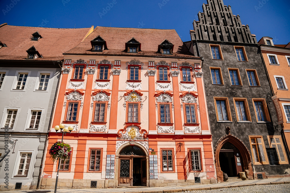 Fototapeta premium Cheb, Western Bohemia, Czech Republic, 14 August 2021: King George of Podebrady Square, Eger at sunny summer day, medieval colorful gothic merchant, historic renaissance and baroque buildings