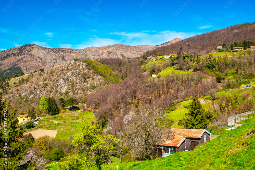 Springtime view of the hills of the Ligurian hinterland, behind the city of Genoa (Ligurian Region, Northern Italy). Springtime view of the hills of the Ligurian hinterland, behind the city of Genoa (Ligurian Region, Northern Italy).