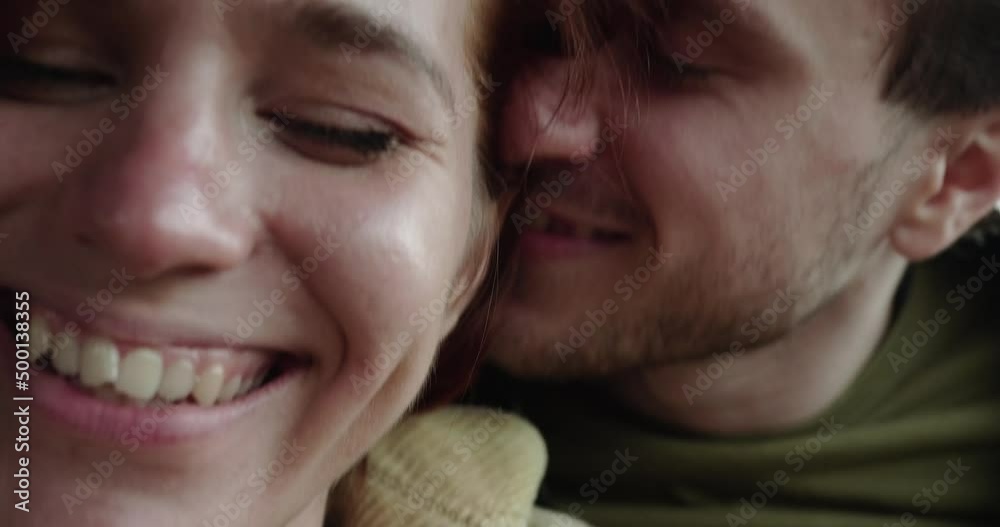 Young happy couple sits in car hugging and smiling closeup Young happy couple sits in car hugging and smiling closeup