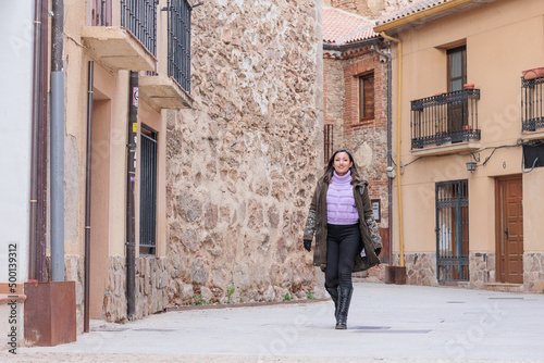 Buitrago de Lozoya local tourism in Madrid. Young Latin honduran woman travel on holiday trip © Sangiao_Photography