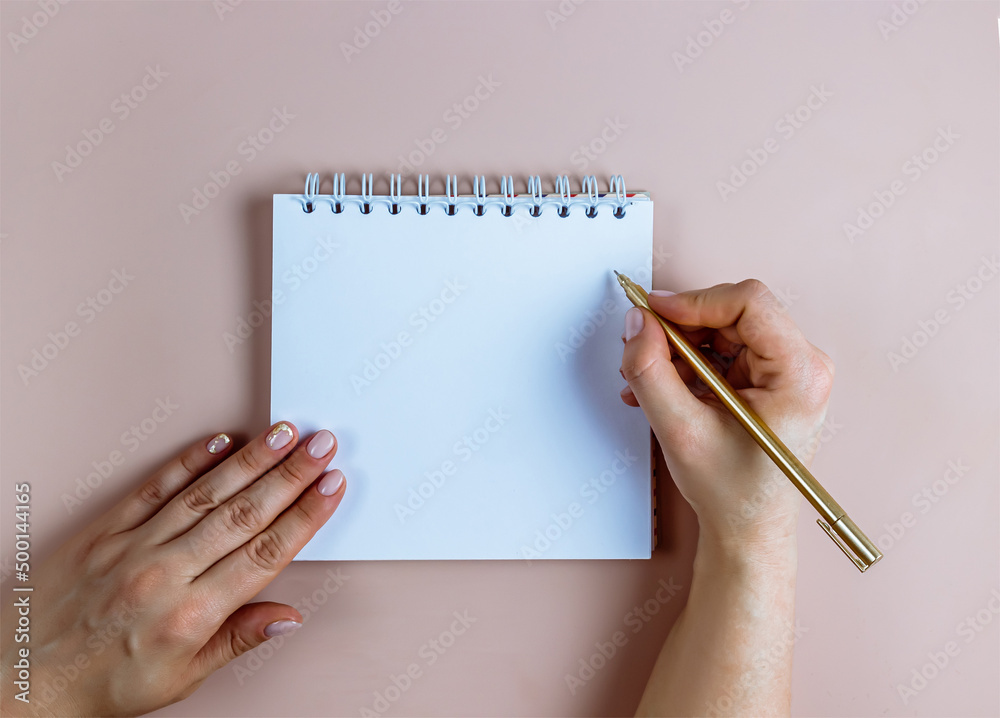 To do list in spiral notepad on pink festive background. Flat lay, top view. To do list in spiral notepad on pink festive background. Flat lay, top view.