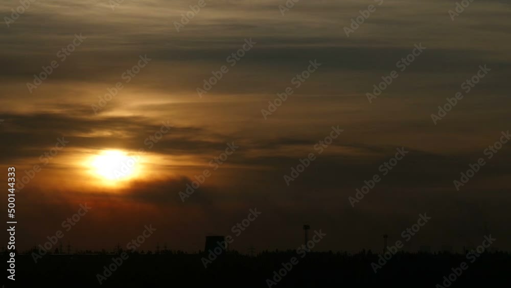 View of plant emissions and industry emissions visible during colorful sunset. Sunset sky over the silhouette of the plant. Air pollution. Industrial factory pollution of ecology. View of plant emissions and industry emissions visible during colorful sunset. Sunset sky over the silhouette of the plant. Air pollution. Industrial factory pollution of ecology.