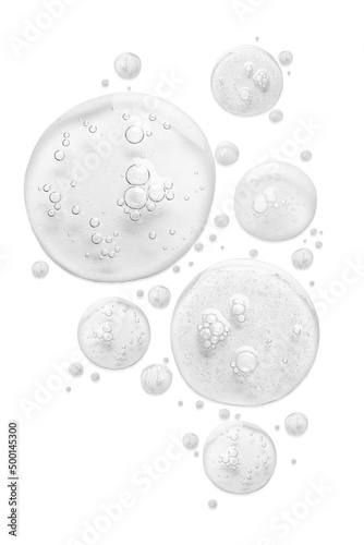 Drops of cosmetic serum on white background
