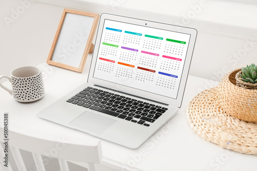 Laptop with open calendar a...