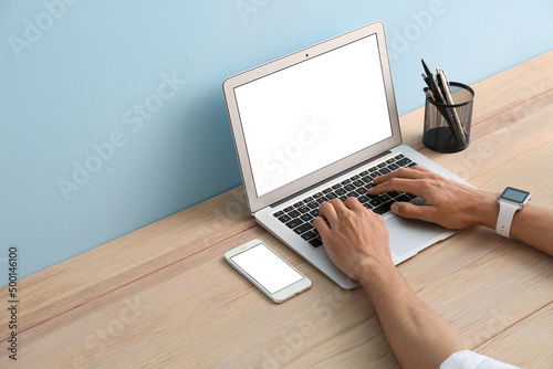 Man with modern devices working in office