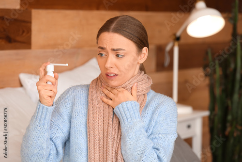 Ill young woman with sore t...